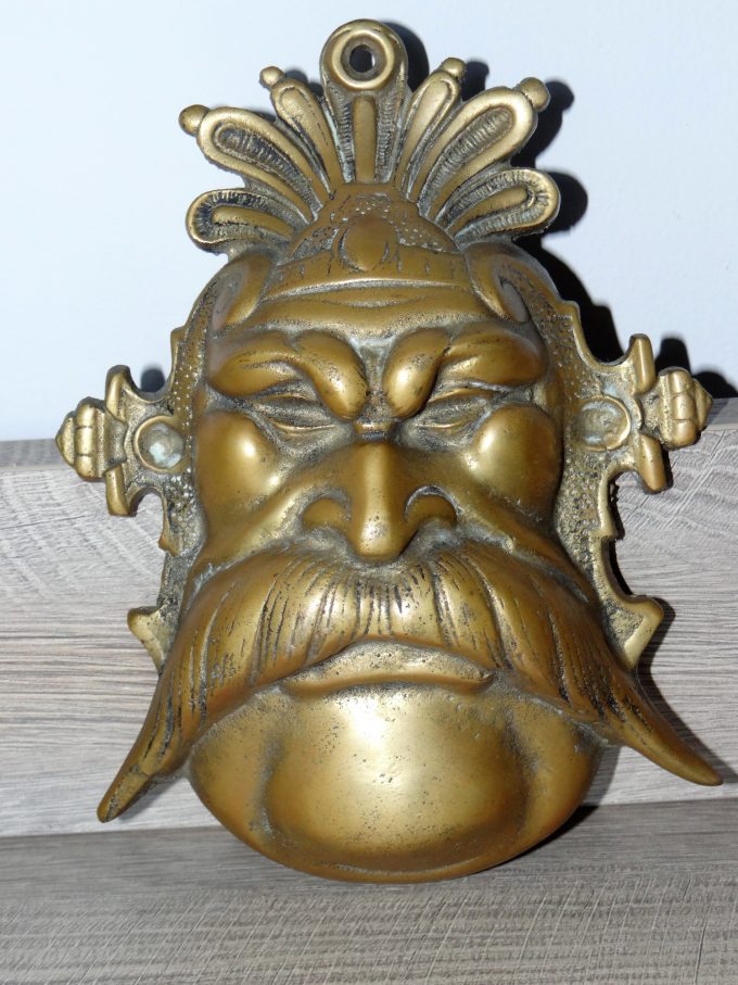 Brass sculpture, patriarch, symbol of power, mustachioed man, representation of experience,